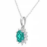 0.6ct Oval Emerald and 0.25ct Diamond Cluster Pendant in UK Hallmarked  9ct White Gold